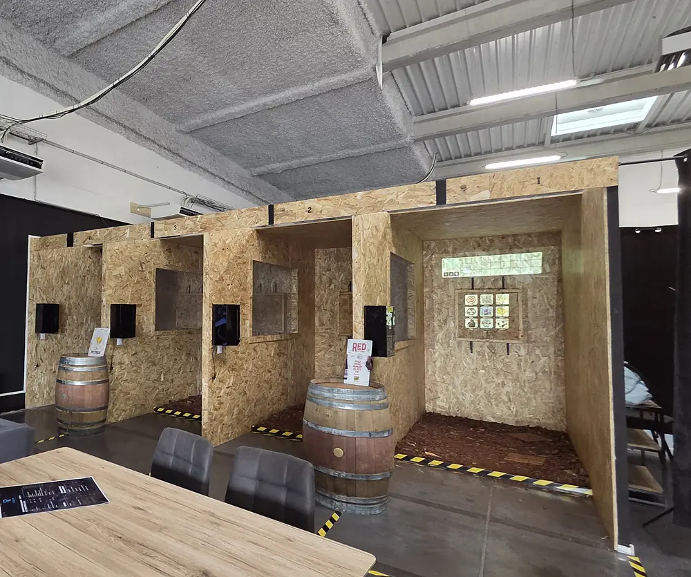 The wooden axe-throwing lanes in the BassinVR lounge